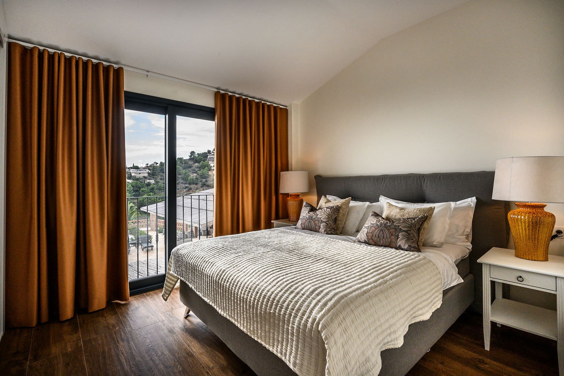 A bedroom at Villa Naranja with a large bed and soft natural light.