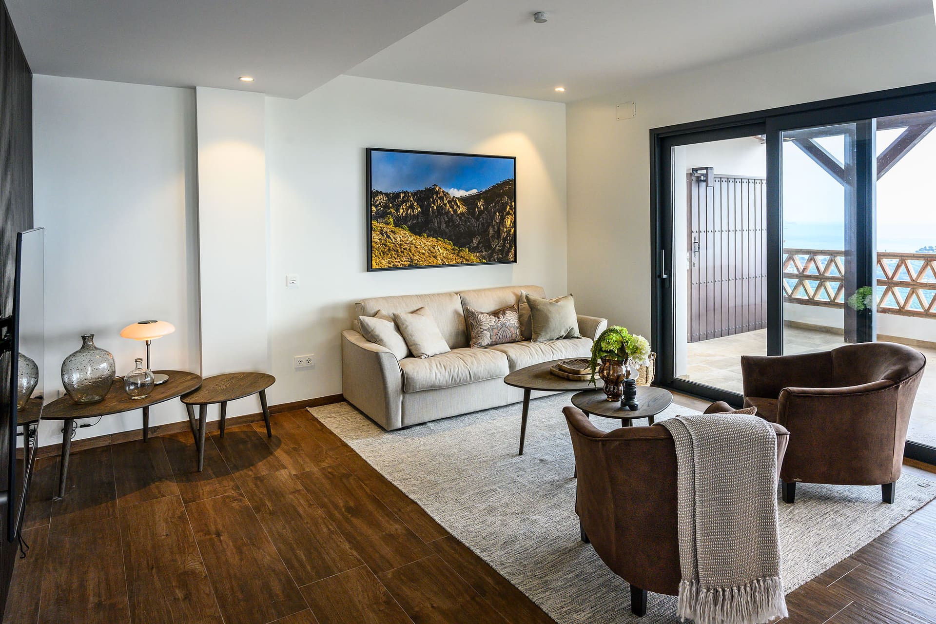 The living room at Villa Naranja, open to the terrace and the sea beyond.