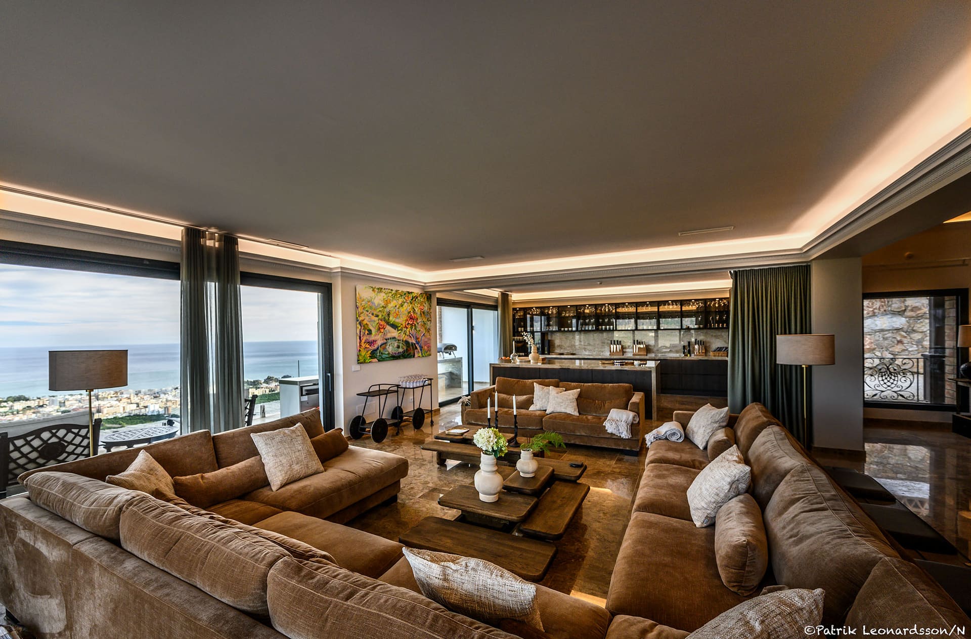 El Palacio's lounge, deep sofas and the sea beyond the windows.