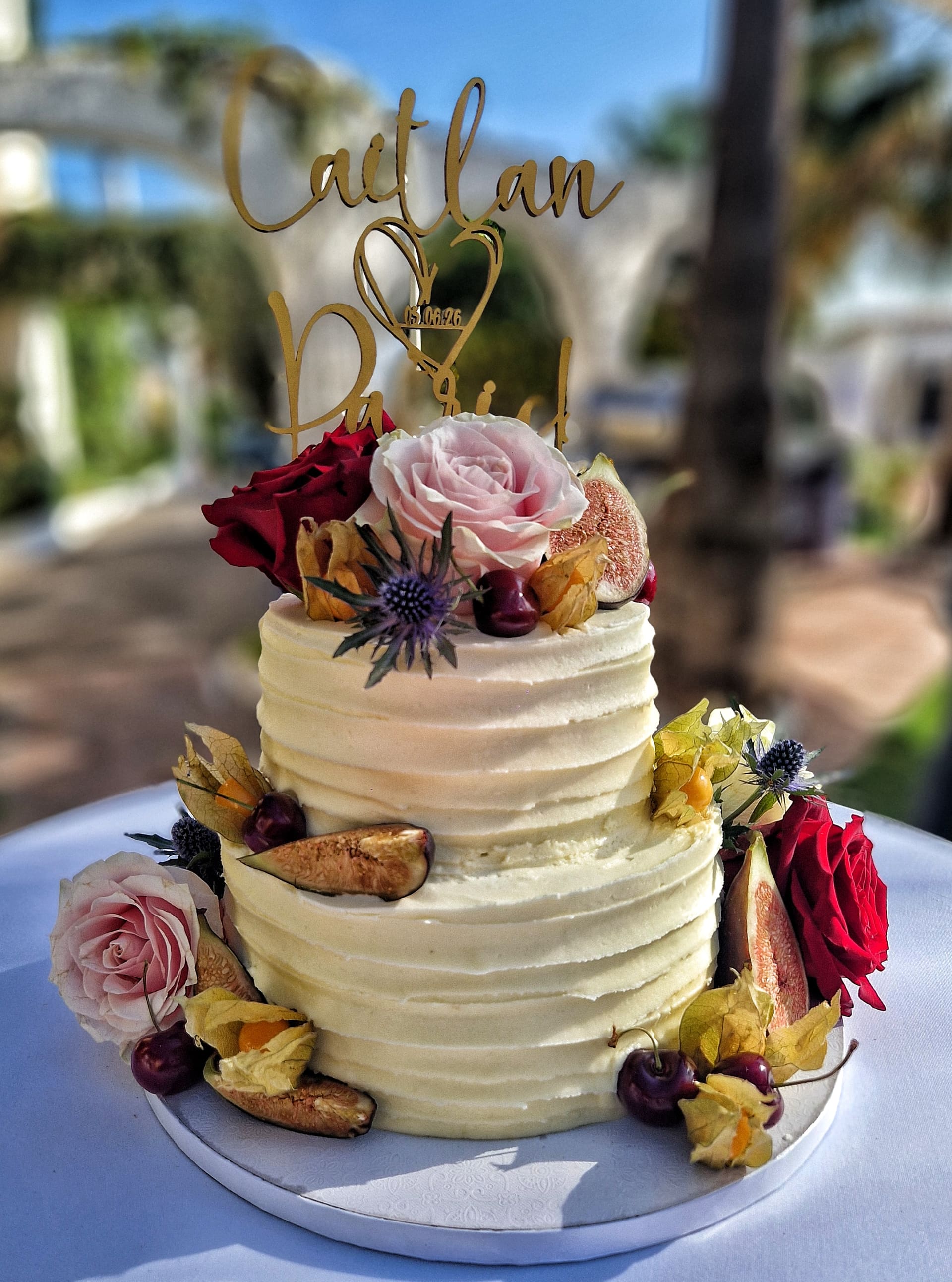 A wedding cake decorated with flowers.
